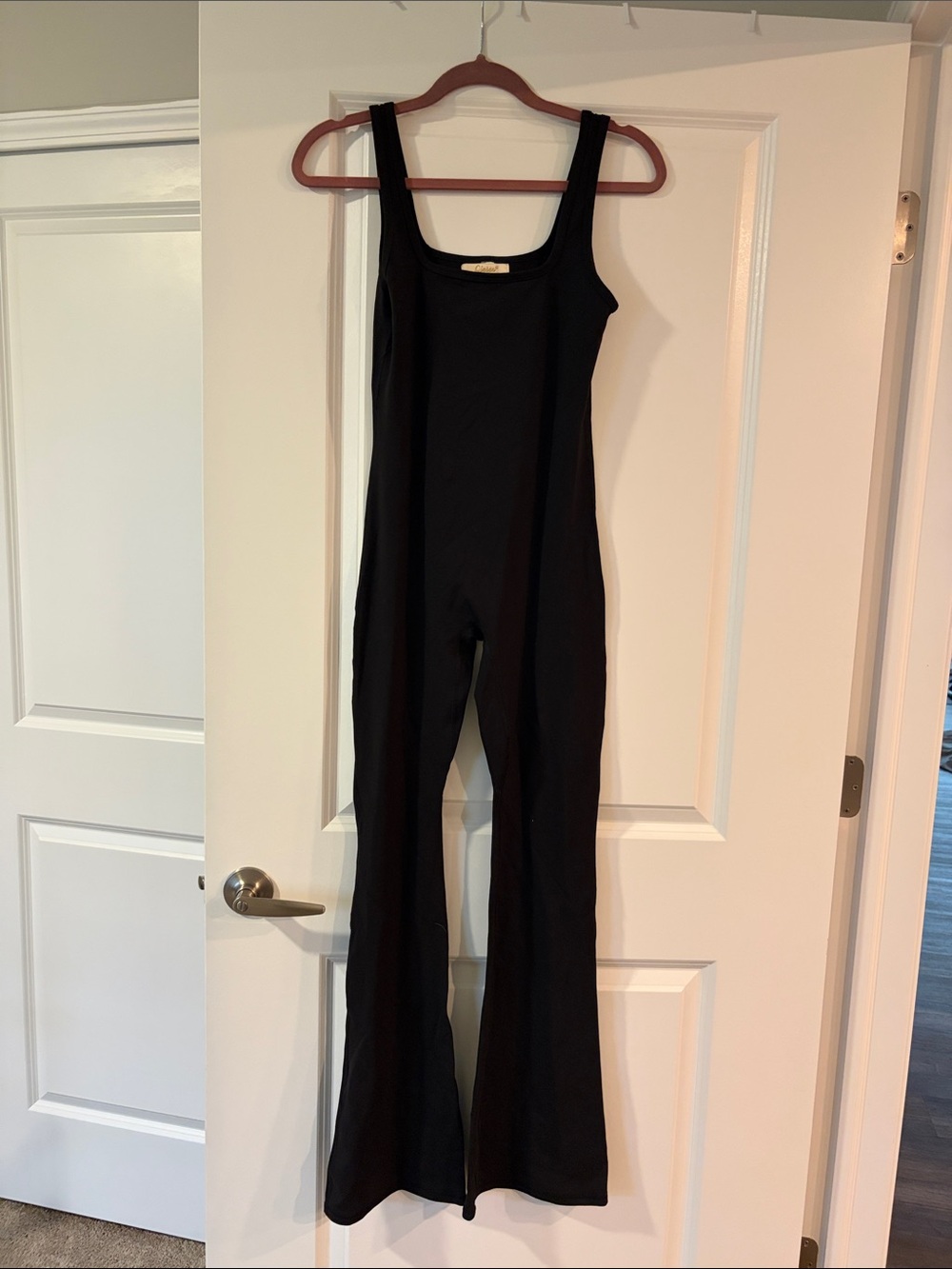 Sleek Black Scoop-Neck Jumpsuit with Flared Legs